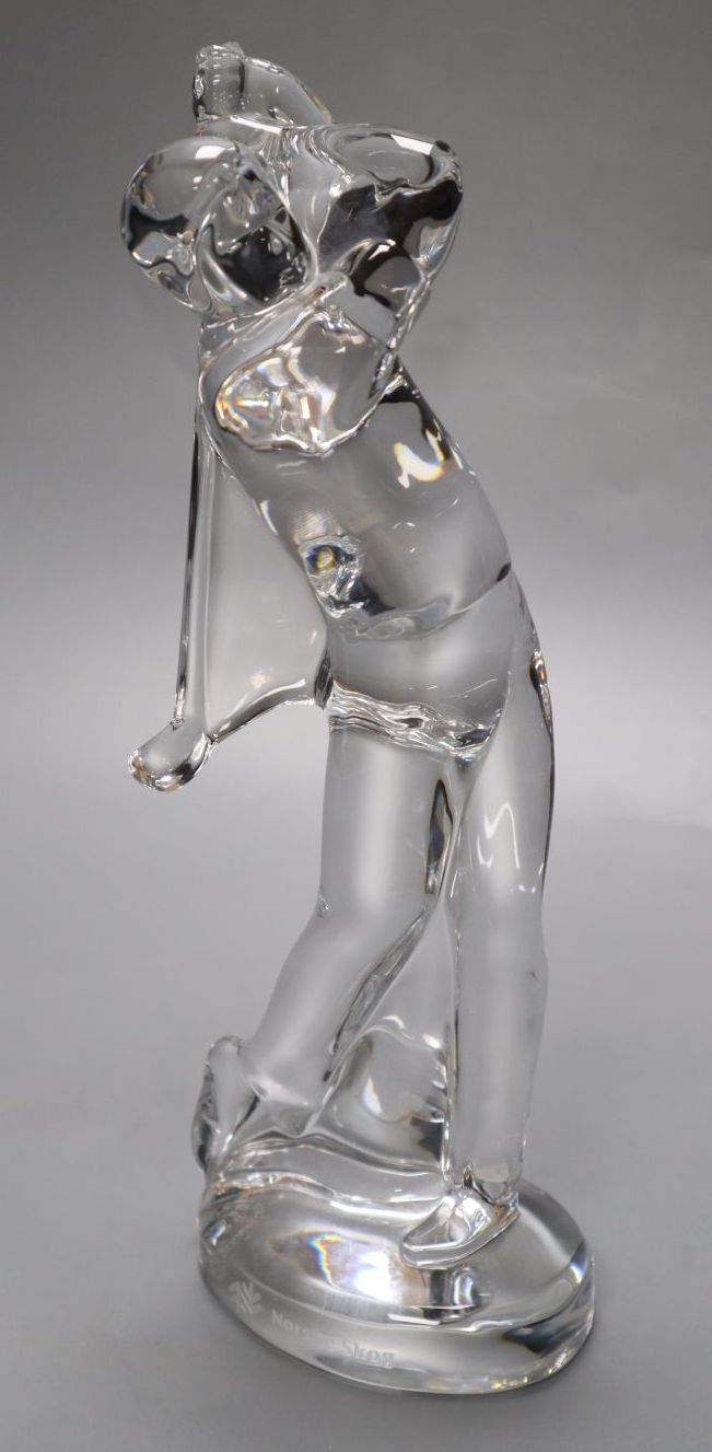 A Baccarat glass model of a golfer, inscribed Norske Skog, 24cm